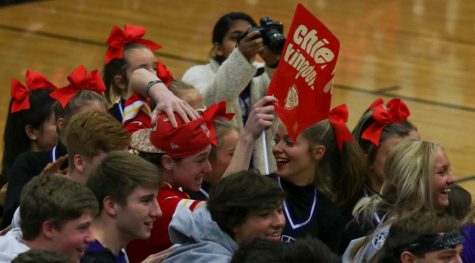Junior Jeremy Bredemeier waves a 'Chiefs Kingdom' flag during the Sweetheart assembly, Jan. 31. Bredemeier is a life-long Chiefs fan.