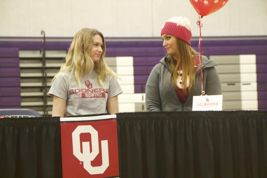Senior Jenna Calton signs with the University of Oklahoma rowing team  at the spring athletic signing ceremony, Feb. 6. 