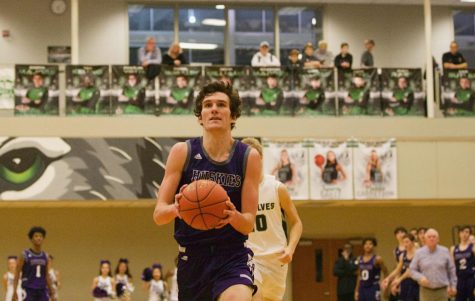 Junior Jack Chapman drives in for a layup in the boys varsity basketball win against Blue Valley Southwest, 70-51.