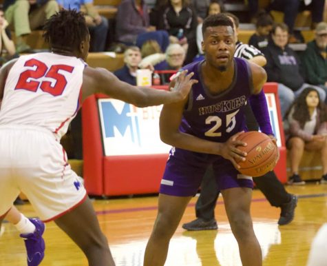 Senior Markell Hood (25) prepares to pass the ball to the wing in a 70-56 win over Bishop Miege.