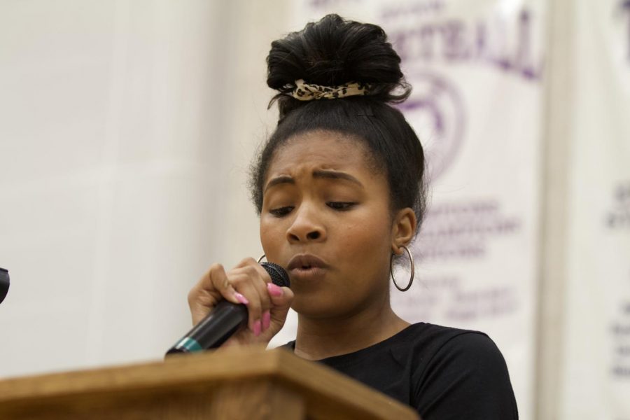 Senior Kenzie Iszard reads a poem during the diversity assembly, Mar. 6. 
