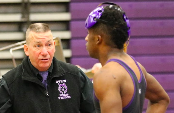 Head coach Tim Serbousek talks with senior wrestler Edward Thomas during a dual on Jan. 15 at BVNW. As the head coach for 27
years, Serbousek holds a 426-182-1 record as head coach. Former athletic director Steve Harms said that Serbousek knows what it
takes to be a successful head coach and has the correct priorities for his team.