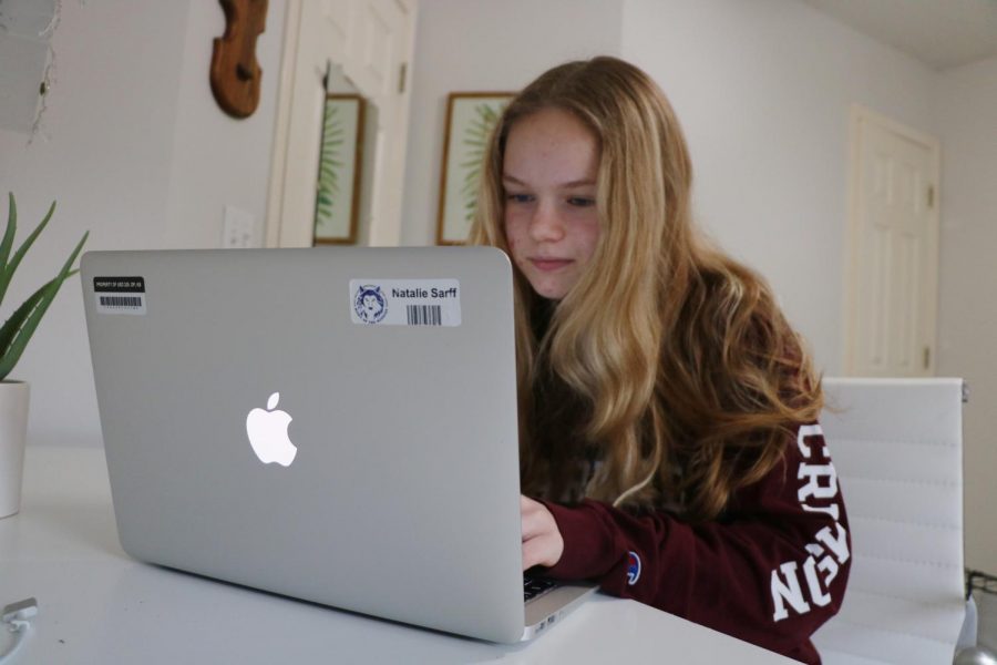 Freshman Natalie Sarff works on her school issued MacBook while at home.