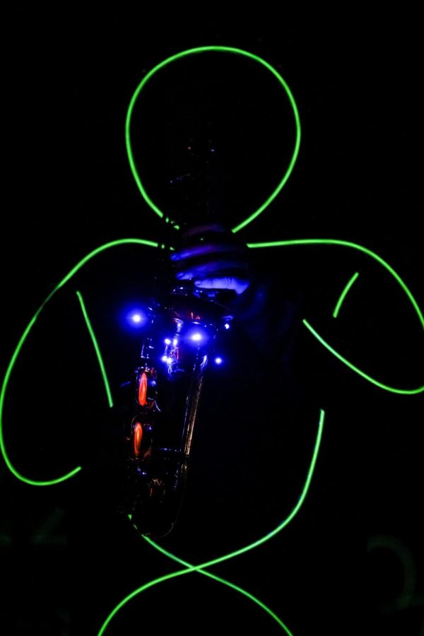 A Howlin Husky marching band member performs in the annual Glow Show, Nov. 2.