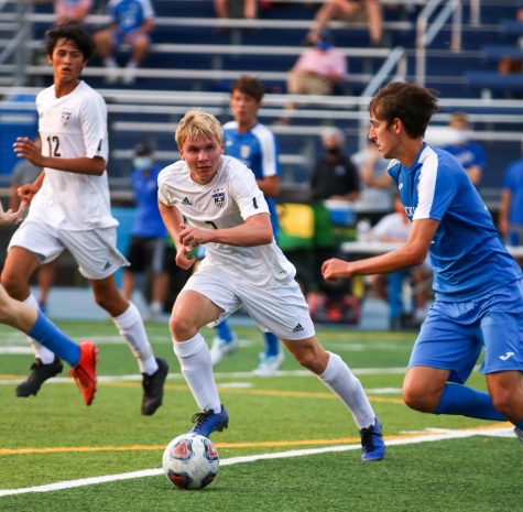 Senior Aidan Knauth runs to stop a breakaway, Sept. 15.