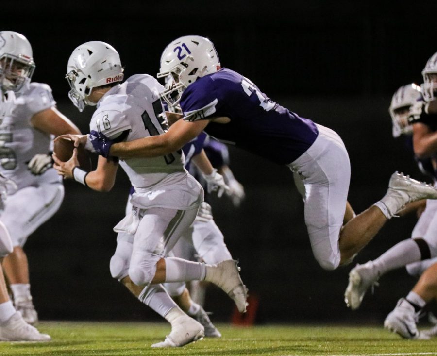 Senior Leo Clennan sacks the quarterback against Blue Valley North, Oct. 9.