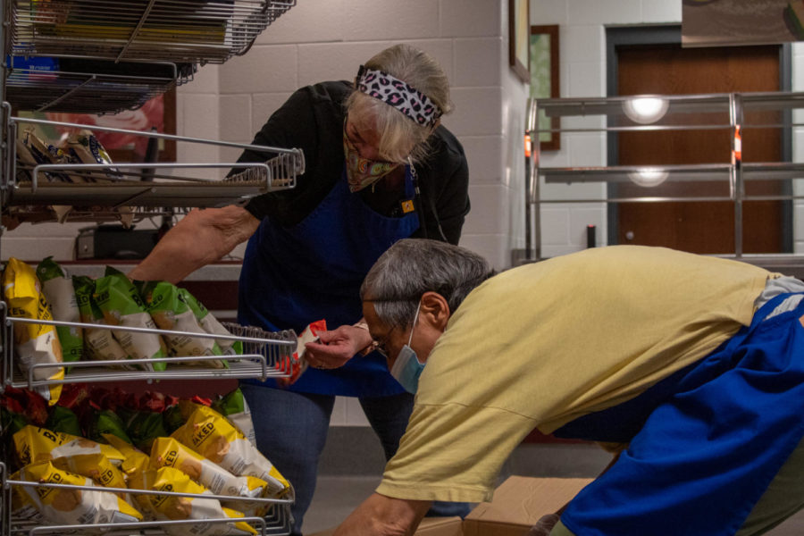 Cafeteria workers put out chips to be purchased, as students say they ran out of student meals, March 23. 