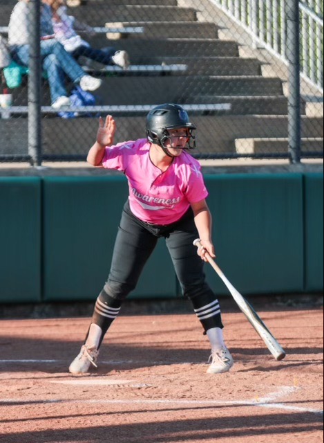 Senior Olivia Shin waits for a pitch in the varsity softball pinkout game.