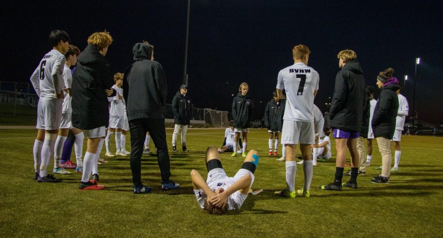 The+boys+varsity+soccer+team+stands+in+a+huddle+after+losing+to+Washburn+Rural+in+the+state+semifinals%2C+Nov.+5.