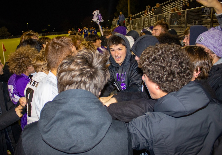 After winning the first round of the playoffs, the soccer team and BVNW students celebrate the win over Olathe South, Oct. 26. The Huskies defeated the Falcons, 3-2.