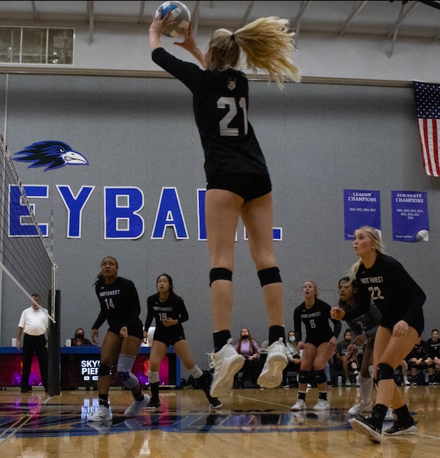 Junior Avery Ahlers goes up to tip the ball during the substate championship match against Olathe Northwest, Oct. 23. The Huskies lost the match, 2-1.