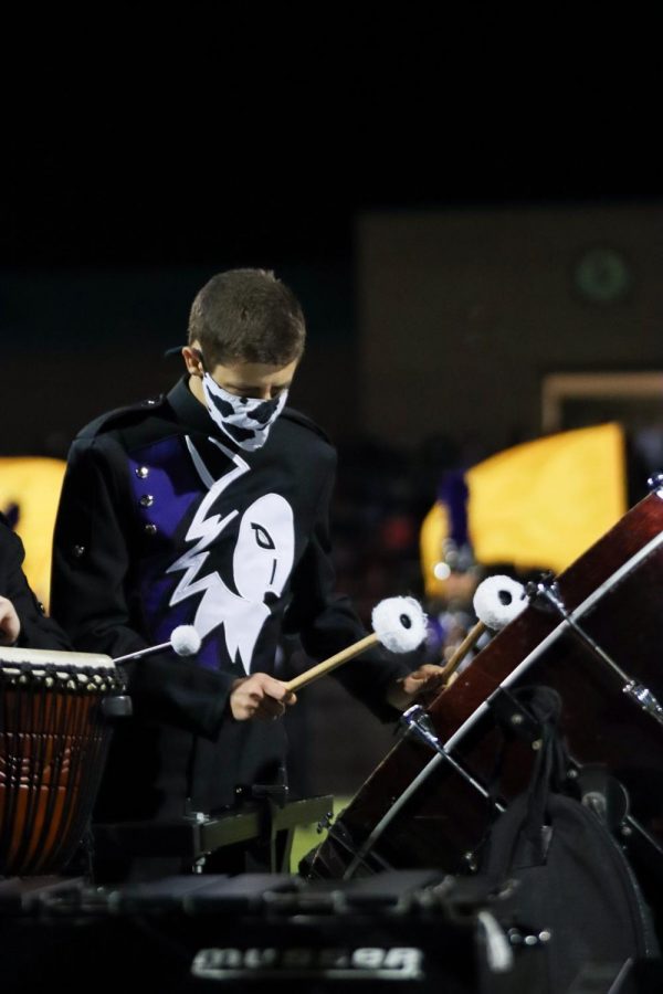 On percussion, junior Elijah Henderson plays with the rest of the BVNW Band during halftime of the football game, Oct. 22.
