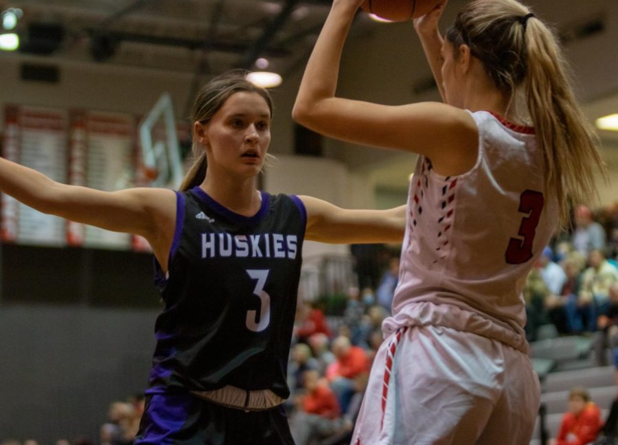 Sophomore Ava Smith defends the ball on an inbound pass in the Huskies 47-29 win over the Jaguars, Jan. 7.