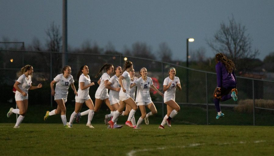 The+Huskies+celebrate+after+senior+Megan+Yates+game-tying+goal+in+the+4-3+win+over+Blue+Valley+West%2C+April+26.