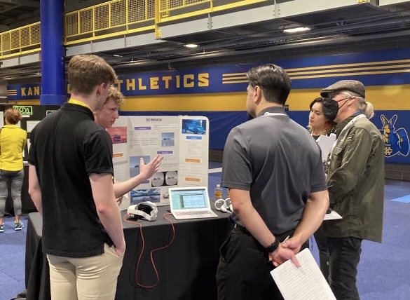 Seniors Tyler Lively and Jackson Brueckner present their design at the 2022 Kansas City Invention Convention. (Photo courtesy of Tyler Lively)