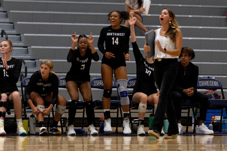 Sisters Akayla and Amya Kodar both play for the BVNW varsity volleyball team and celebrate on the sideline of a game.