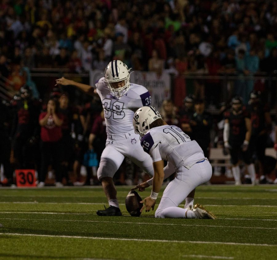 Freshman kicker Trace Rudd scores the extra point for the Huskies, Sept. 23.