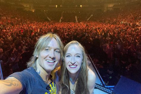 FACS teacher Elizabeth Warren takes a selfie with Keith Urban after being invited onstage at his Fort Worth concert, Oct. 1.