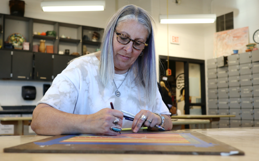 Chris LaValley, the ceramics and painting teacher, works on her latest art piece. “This series focuses on where my inspiration from nature began and my enjoyment on focusing on smaller details and elements most would miss,” LaValley said.