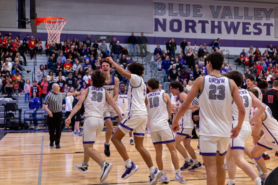 After the boys varsity basketball game against the Blue Valley West Jaguars, the Huskies celebrate their win, Feb. 10. 