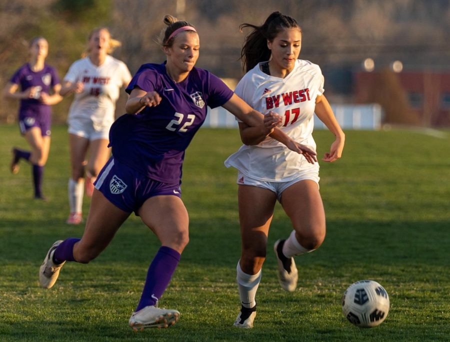 Junior Emily Peterson (22) plays in the girls varsity soccer game against Blue Valley West, on April 6. 