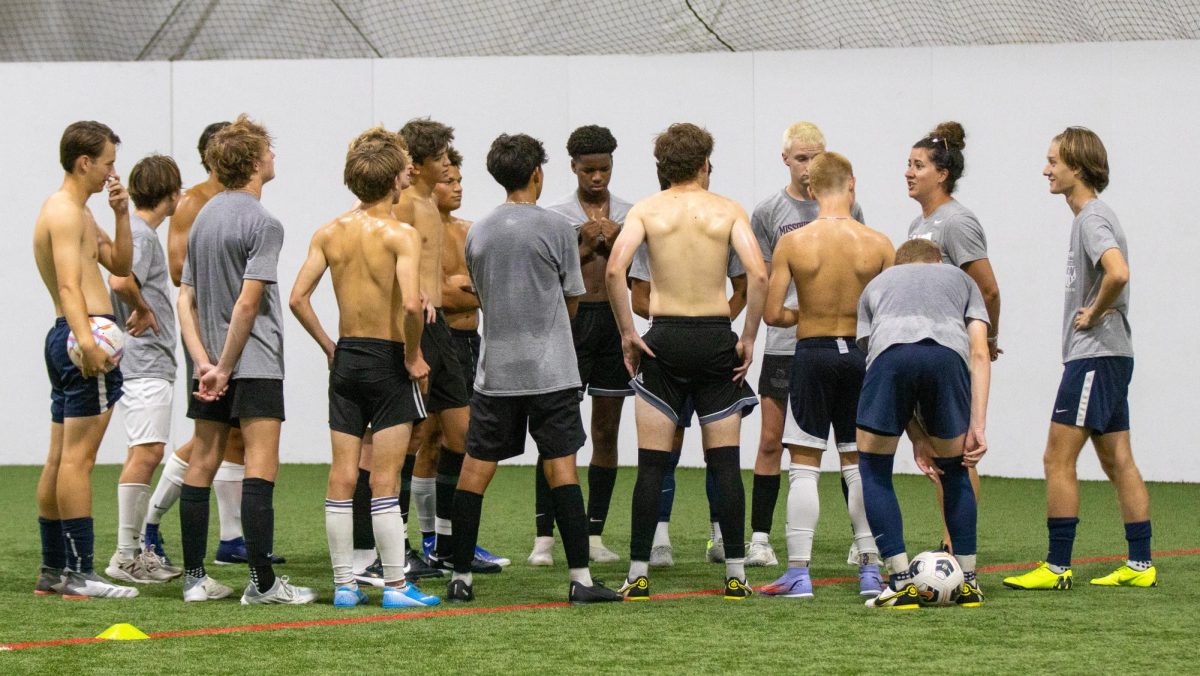 The boys soccer team practices indoors during a heat wave.