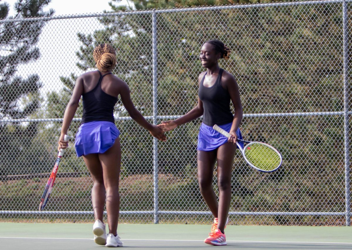 Doubles partners Saraphina Wambi (left) and her sister Maryam Wambi (right) took second place at tennis regionals. 