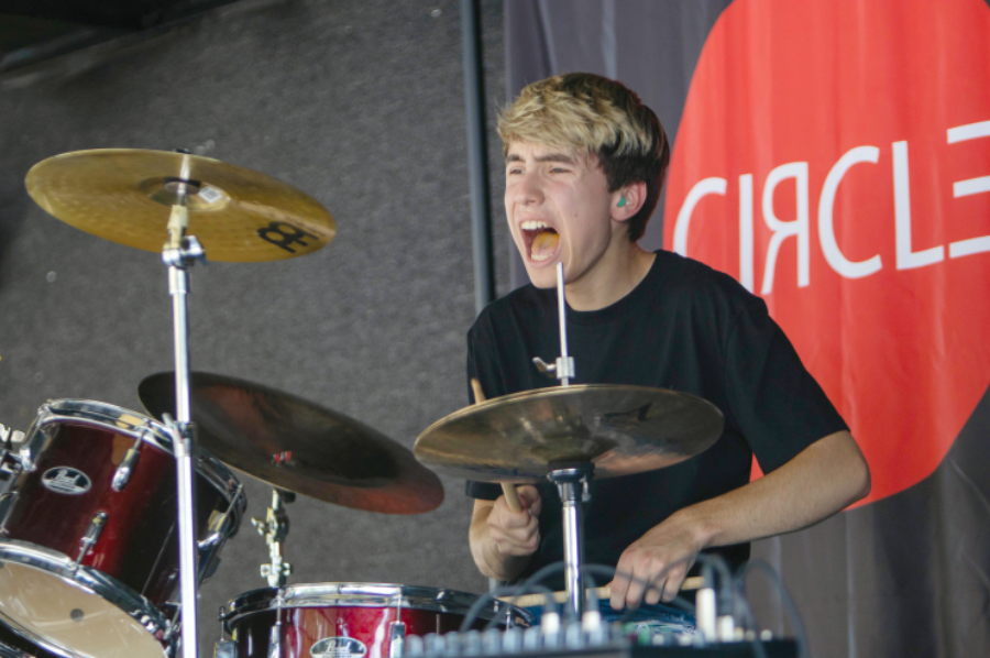 Sophomore Brody Bates plays the drums for Circle Drive at a performance at Smoking n Waldo.