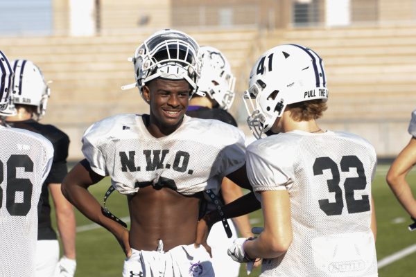 After drills during football practice on Sept. 25, Keon King exchanges jokes with his teammates. “I started talking to people [about] how I felt. I also decided to focus on being a better person and supporting others. I wanted to make sure people knew they had someone to talk to," King said.