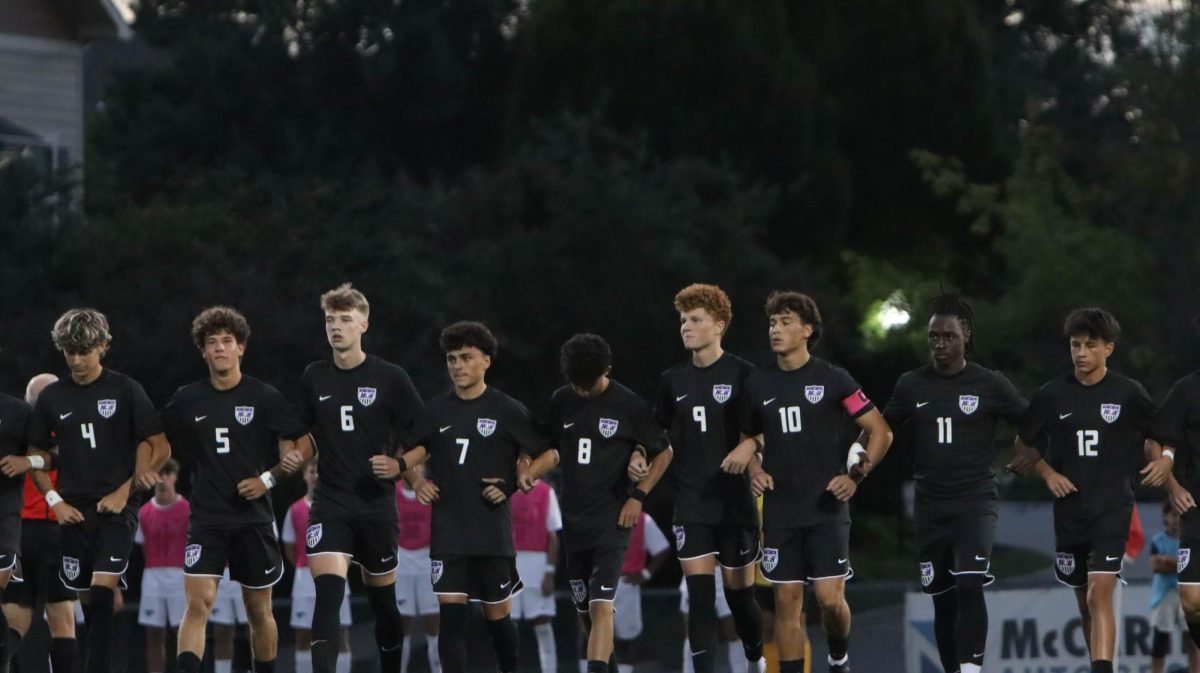 Soccer team defeated in opening game on newly named field.