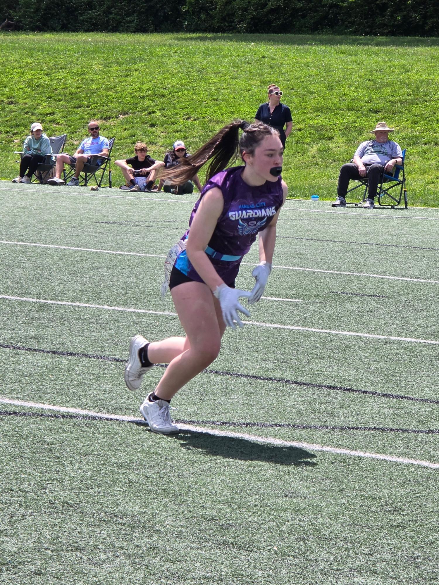Sophomore Hannah Holman runs a go route at a flag football game on May 3. (Photo courtesy of Hannah Holman). 