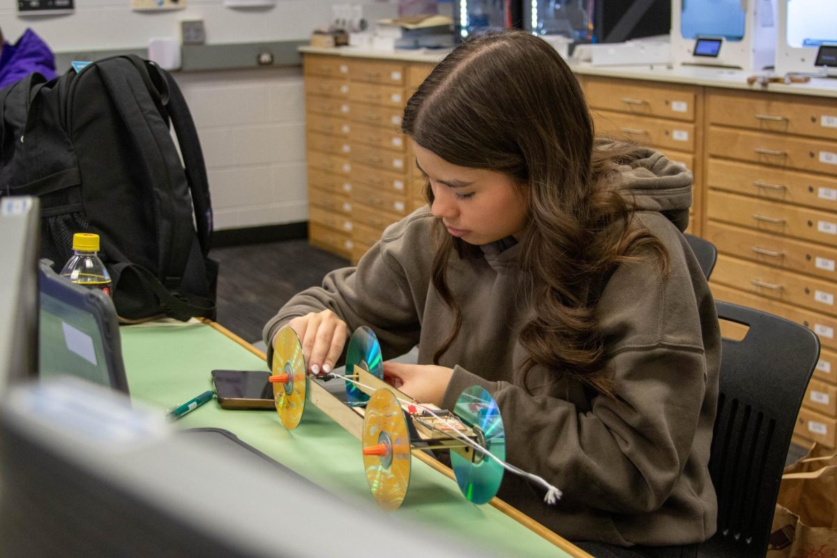 While in drafting class, senior Megan Beattie works on a new project.